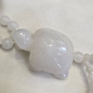 White Quartzite Beads And Carved Turtle Tassel Necklace